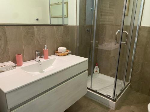 a bathroom with a sink and a shower at relax home in Marsala