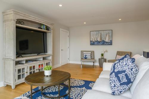 a living room with a white couch and a table at 557 Route 28, Unit 202, Harwich Port Cape Cod - -Dolce Vita in Harwich Port
