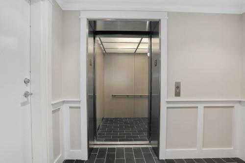 a hallway with a walk in shower in a building at 557 Route 28, Unit 202, Harwich Port Cape Cod - -Dolce Vita in Harwich Port