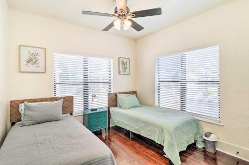 a bedroom with two beds and a ceiling fan at Stunning Jacksonville Getaway with Backyard! in Jacksonville