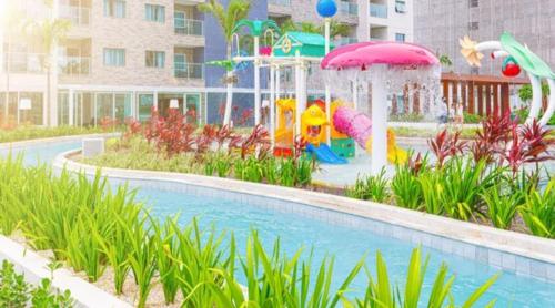 a swimming pool with a playground in a resort at Salinas Exclusive Resort in Salinópolis