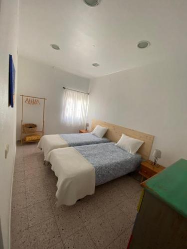 a bedroom with two beds in a room at Stay Porto Côvo II in Porto Covo