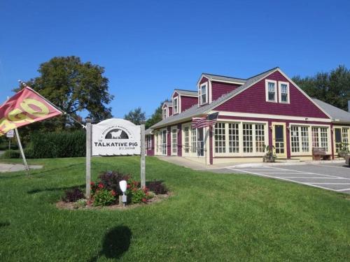 a large red building with a sign in front of it at 24 Sea Mist Lane Chatham Cape Cod - - The Sea Mist in South Chatham