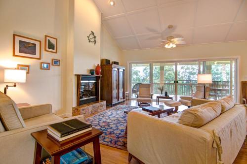 a living room with a couch and a table at Hale Luana Big Island in Paauhau