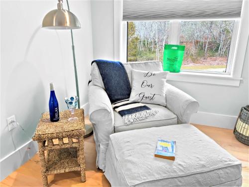 a living room with a couch and a chair at 31 Pine Road West Dennis Cape Cod - - Shark Lookout in West Dennis