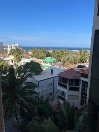 an aerial view of a city with buildings and palm trees at Superb Urban Oasis in Almadies in Dakar