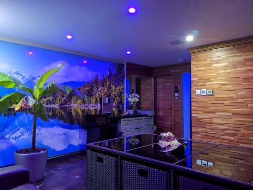 a kitchen with a large painting on the wall at 1 Bedroom Guest House with Sauna and Steam Room in Kent