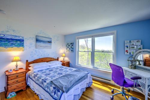 a bedroom with a bed and a desk and a window at 123 Salt Marsh Road East Sandwich - - Cape Cod in East Sandwich