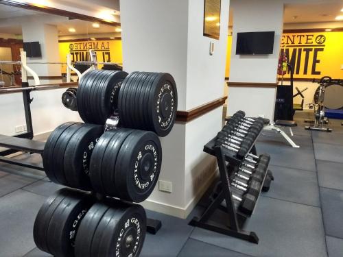 a row of dumbbells in a gym at Bristol Hotel in Buenos Aires