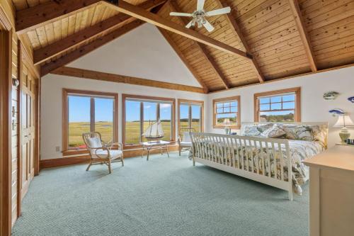 a bedroom with a bed and a ceiling fan at 7 Sunrise Lane Sandwich Cape Cod - - Sunrise Vista in Sandwich
