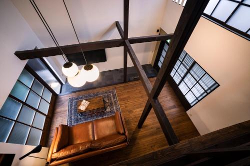 an overhead view of a living room with a leather chair at Rinn Shiki Juraku in Kyoto