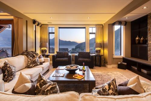 a living room with a couch and a table at Karamata by MajorDomo in Queenstown