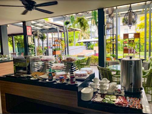 a buffet with food on a table in a restaurant at Heritage Park Hotel in Honiara