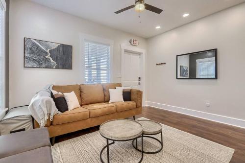 a living room with a couch and a tv at Ybor Azul Den in Tampa