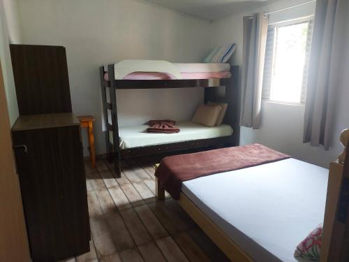 Postel nebo postele na pokoji v ubytování Casa de Campo Pedra Bicuda