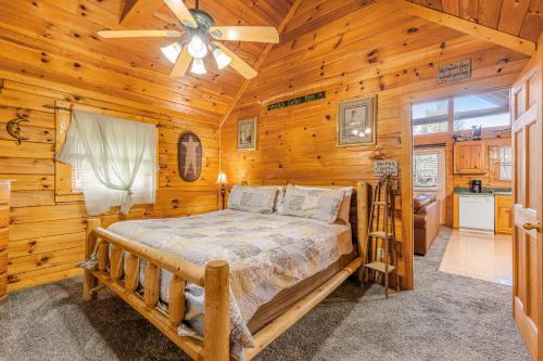 a bedroom with a bed and a ceiling fan at Moonlight Romance in Pigeon Forge