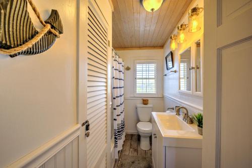 a bathroom with a toilet and a sink at 197 North Shore Boulevard East Sandwich - Cape Cod in East Sandwich