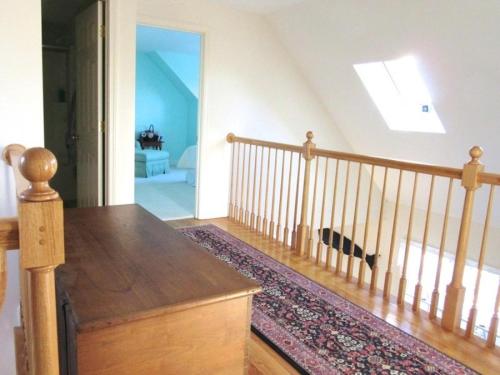 a room with a staircase and a stair case at 151 Sky Way Chatham Cape Cod- -Cape Time in Chatham