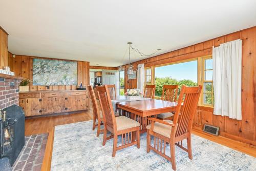 a dining room with a table and chairs at 229 Scatteree Road North Chatham Cape Cod - - Nauset Watch in South Chatham