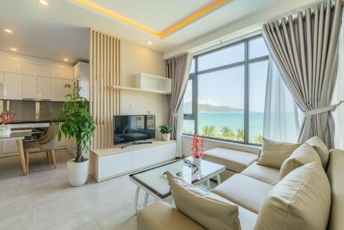 a living room with a view of the ocean at MySea Nha Trang Apartments in Nha Trang