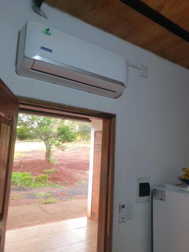 a kitchen with a window and a ceiling fan at Wall Apartamentos in Hohenau