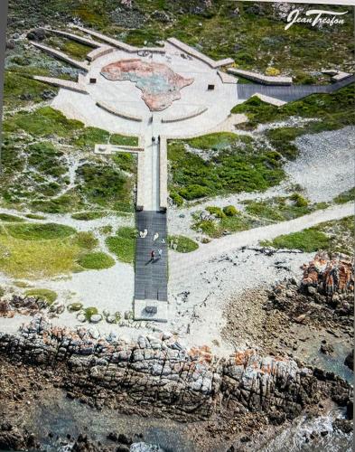 an aerial view of the christ the redeemer statue at Cliff Haven in Struisbaai