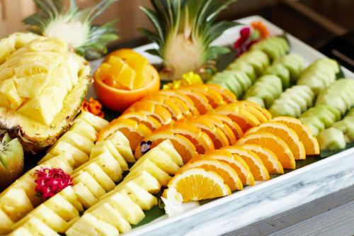 a plate of fruit and vegetables on a table at The358 SORA in Fukuoka