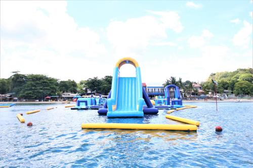 a row of inflatable slides in the water at PALM TREE RESORT AND RESTAURANT in Olongapo