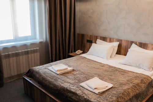 Säng eller sängar i ett rum på Mardin Hotel