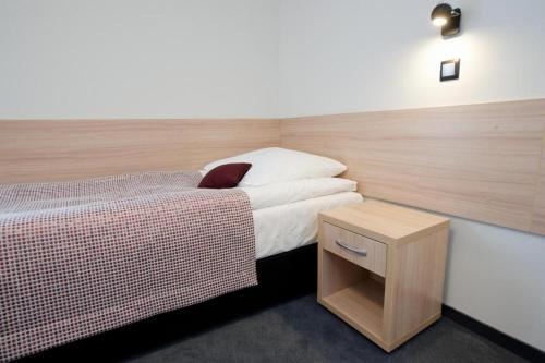Ένα ή περισσότερα κρεβάτια σε δωμάτιο στο Centralny Ośrodek Sportu - Szczyrk