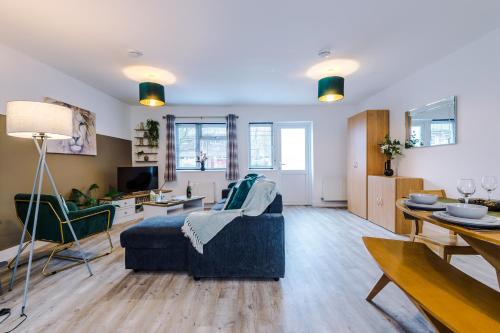 a living room with a couch and a table at Spacious 3-Bed house in Chester by 53 Degrees Property, Ideal for Families & Professionals, FREE Parking - Sleeps 7 in Chester