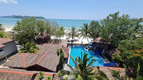 an aerial view of a resort with a swimming pool at Malibest Resort in Pantai Cenang