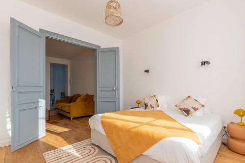 Ένα ή περισσότερα κρεβάτια σε δωμάτιο στο Appartement Porte mars