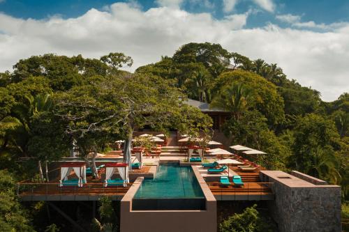 a resort with a swimming pool and lounge chairs at One&Only Mandarina in Lo de Marcos