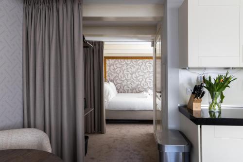 a hotel room with a bed in a room at Amsterdam Canal Suites in Amsterdam
