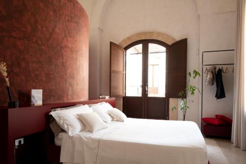 Letto o letti in una camera di Palazzo Donna Titì
