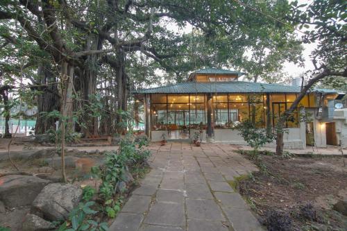 a large building with a lot of windows at Bison Retreat - Pench 