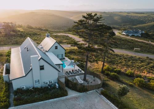 an aerial view of a white house in the countryside at Sky Villa Boutique Hotel by Raw Africa Collection in Plettenberg Bay