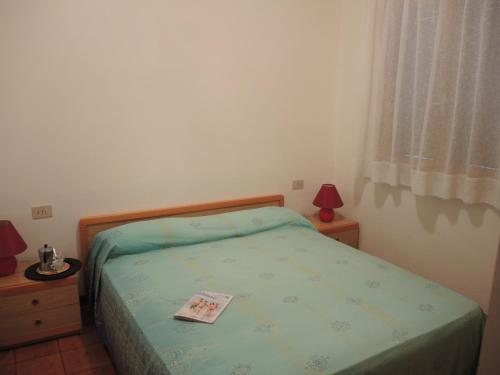 A bed or beds in a room at Villa Katiò
