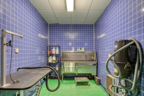 a bathroom with blue tiled walls and a shower at S Boston 1BR w Gym WD by Seaport Lawn on D BOS-335 in Boston