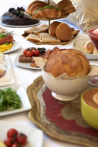 a table topped with plates of food on a table at PALAZZO CIOTTI in Ascoli Piceno