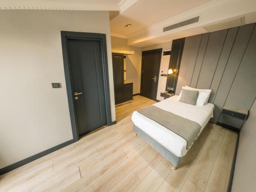Postel nebo postele na pokoji v ubytování Express Plus Hotel