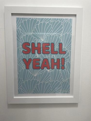 a framed picture of a wall with the words shell yeah at Seadream Luxury Holiday Home with Hot Tub Sleeps 6 in Scarborough