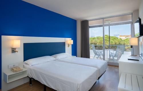 Postel nebo postele na pokoji v ubytování Medplaya Hotel Monterrey