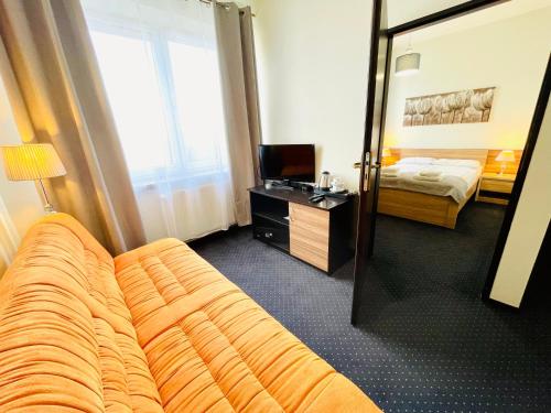 Hotel Seven 7にあるテレビまたはエンターテインメントセンター