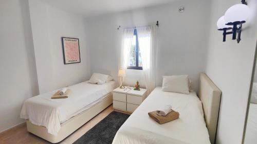 Postel nebo postele na pokoji v ubytování AP231 - Capistrano Playa 611