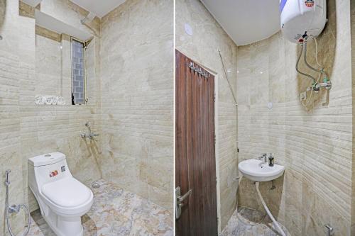 a bathroom with a toilet and a sink at Hotel S B Inn Near New Delhi railway Station Paharganj in New Delhi