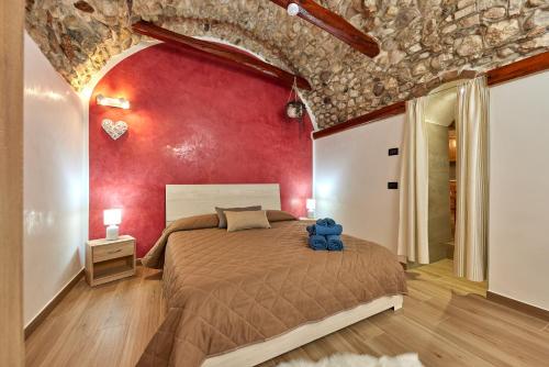 a bedroom with a large bed with a teddy bear on it at EL VOLT in Malcesine