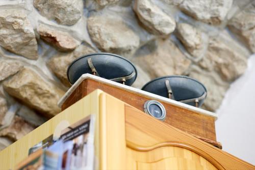 a wooden box with two pots on top of it at EL VOLT in Malcesine