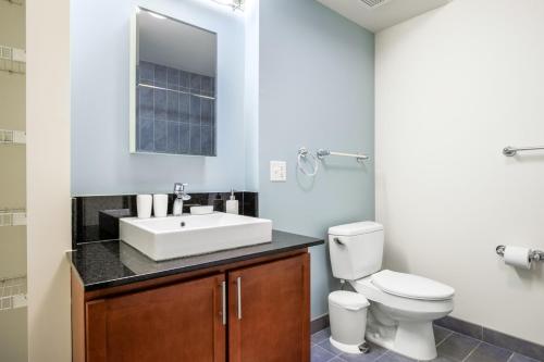 a bathroom with a sink and a toilet at Loop 1BR w Pool Gym nr Financial District CHI-261 in Chicago